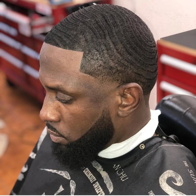 Wave pattern skin fade with full beard at Lavish Cutz